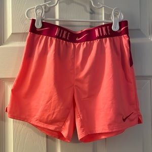 Pink Nike running shorts
